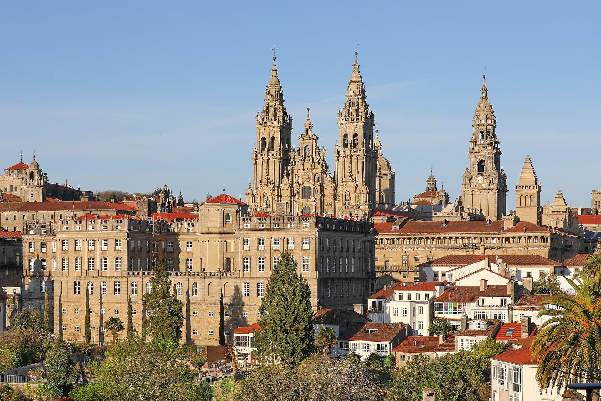 The three towers of the cathedral of Santiago de Compostela rising above the granite palaces and tiled roofs of the old town