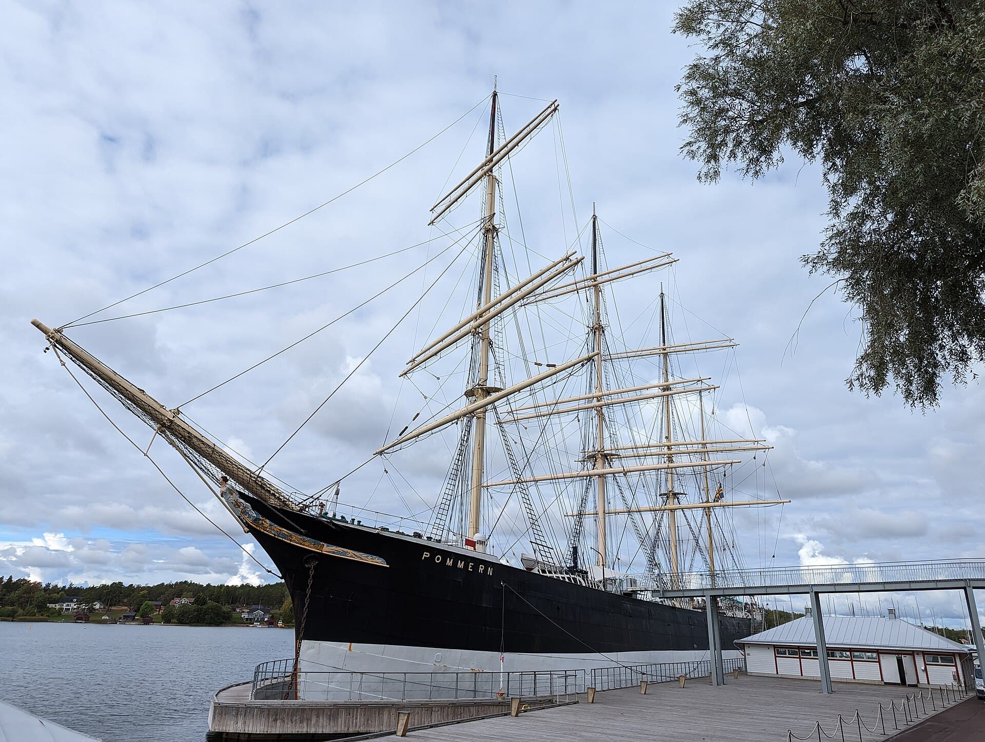 The four-masted barque Pommern moored at the Åland Maritime Museum quay in Mariehamn, seen from ahead, her name painted white on a black hull