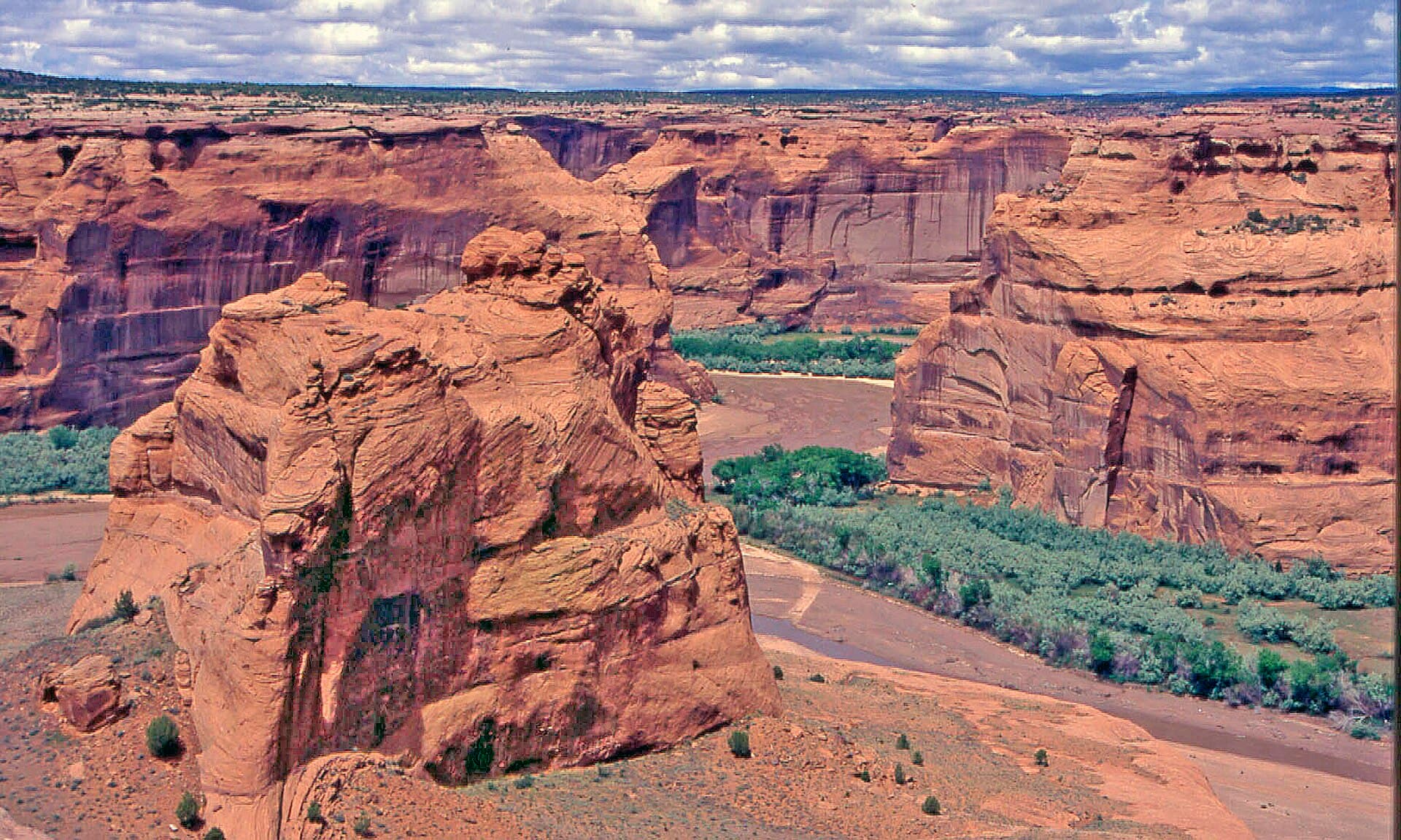 The red sandstone walls and floor of Canyon de Chelly in northeastern Arizona, on the Navajo Nation, farmed and inhabited continuously for thousands of years