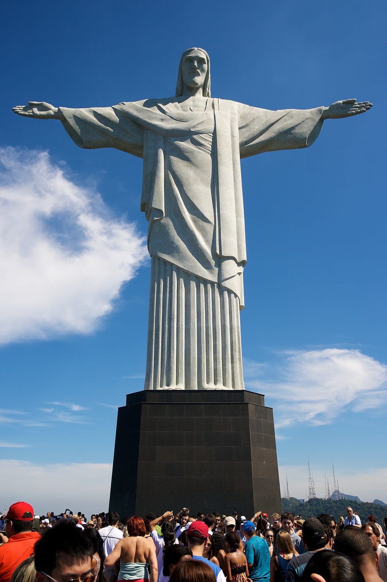 Christ the Redeemer statue with outstretched arms atop Corcovado mountain overlooking Rio de Janeiro
