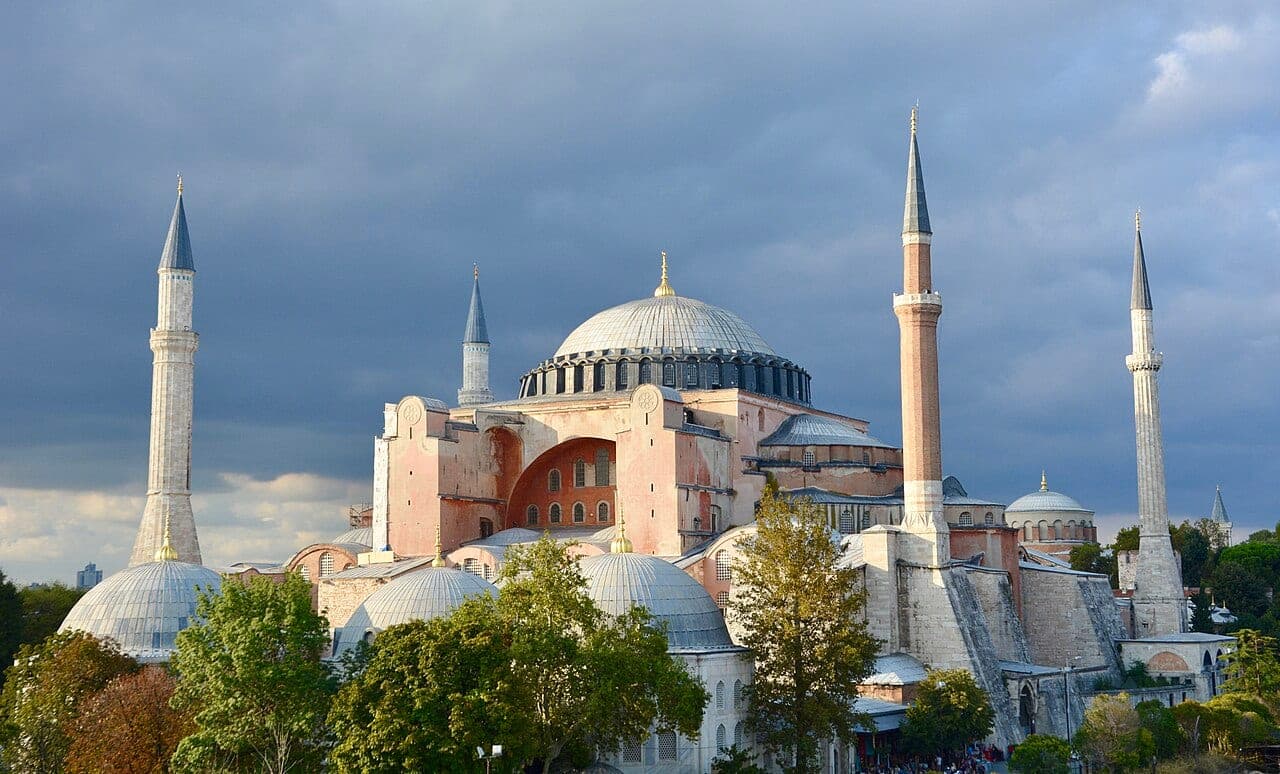 Exterior of Hagia Sophia in Istanbul, its central dome flanked by half-domes and four minarets