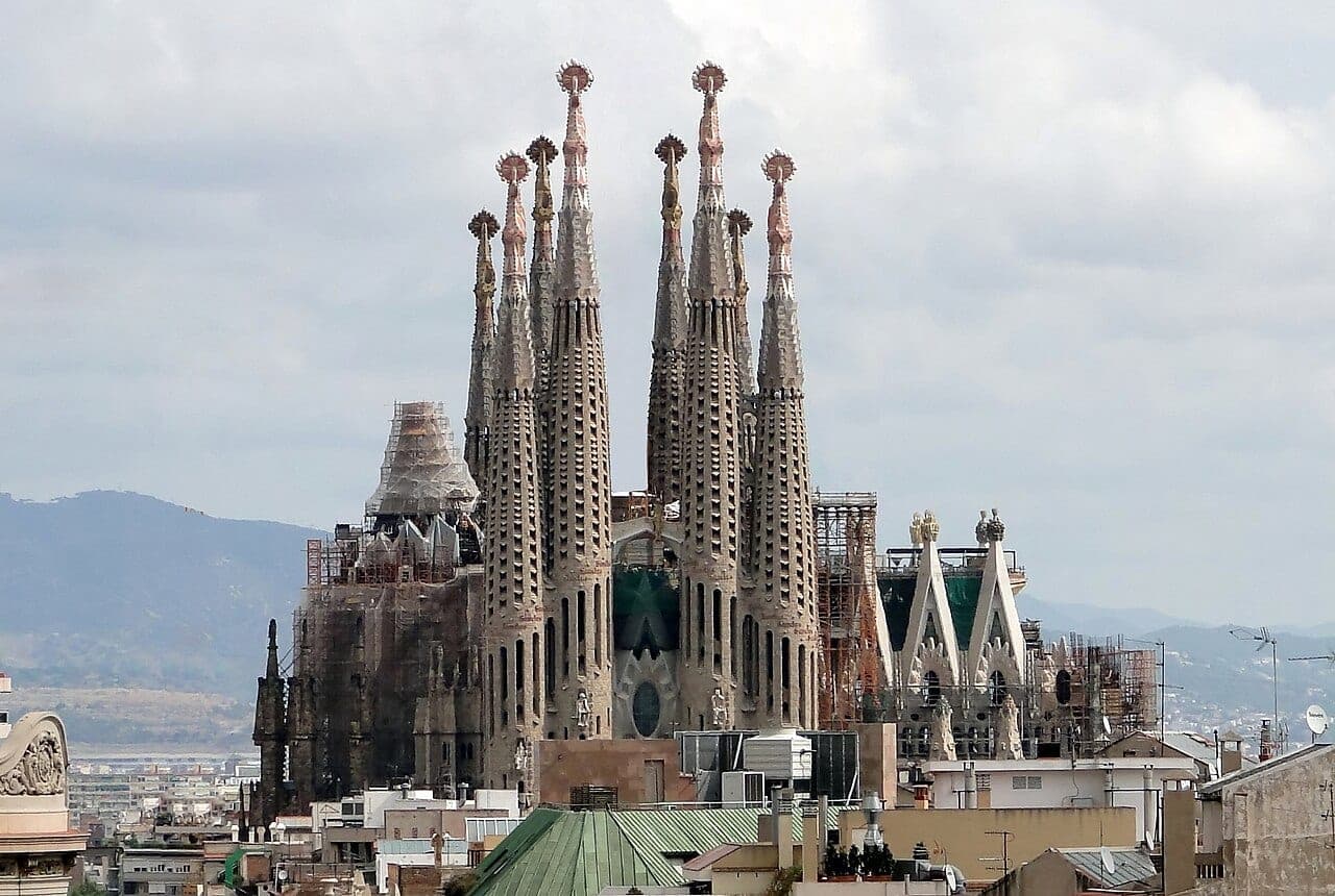 The Sagrada Familia basilica in Barcelona, its ornate spires rising against the sky