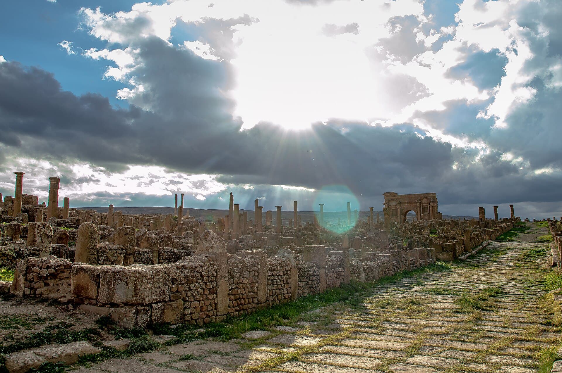 The main street of Timgad with Trajan's arch beyond