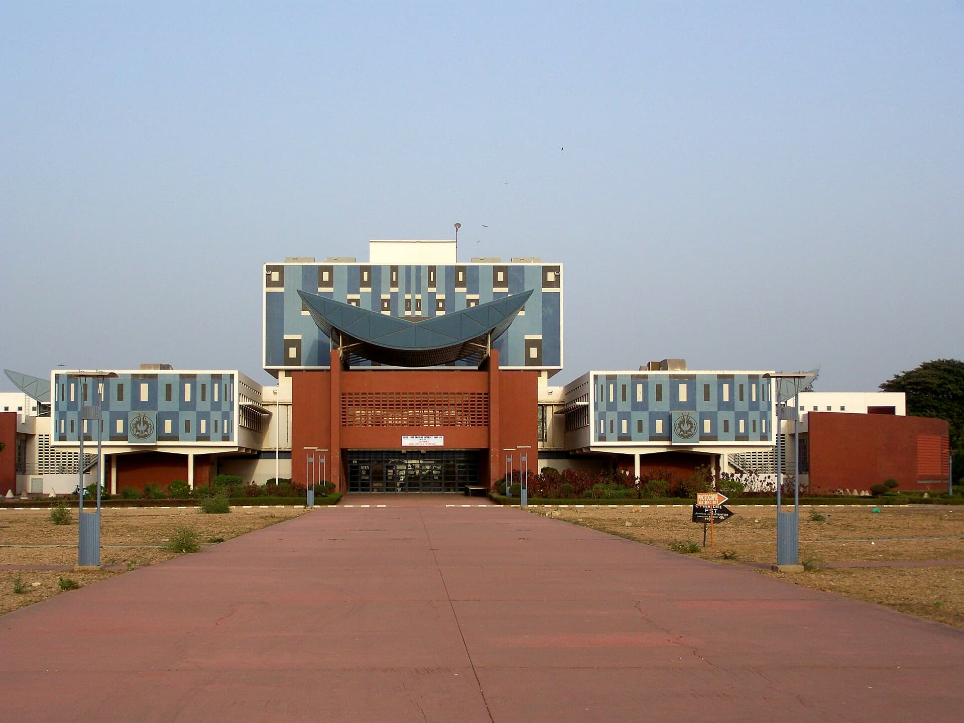 The central library of Cheikh Anta Diop University in Dakar, its chequered blue and white facade at the end of the campus avenue